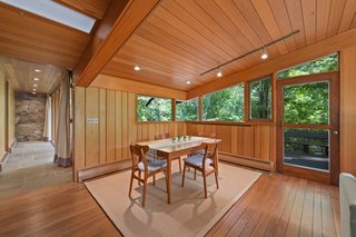 A door connects the dining area to the outdoor sun deck.