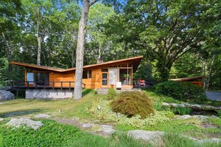 The three-bedroom, three-bath house sits on a nearly two-acre lot, which includes a koi pond and swimming pool in the backyard. The home has been extensively landscaped with rhododendrons, ornamental grasses, forsythia, cut-leaf maple, spirea, hydrangea and pachysandra.