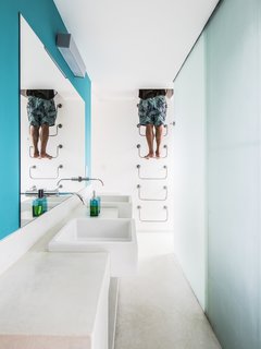 Steps lead up from the bathroom to the mezzanine level above. The mezzanine is accessed via ladder in another part of the house.