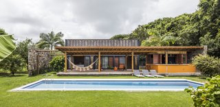 The home is oriented for cooling cross winds that sweep across the pool and bring constant breezes into the bedrooms and relief from the strong tropical heat.