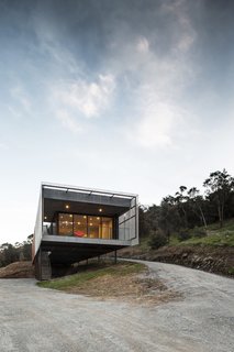 "It was important to the owner as well that the site not be over-excavated, but rather emerge gently out of the existing landscape," explains Chris. "The elevated and light form essentially grew out of this."