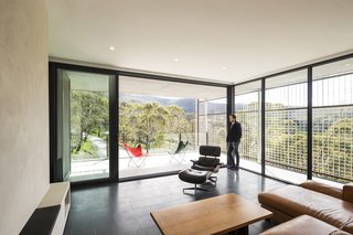 The light-filled living area features Bluestone paving and polished plaster walls.
