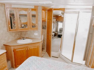 Here is a look at the original bathroom corner with its shiny wood paneling.