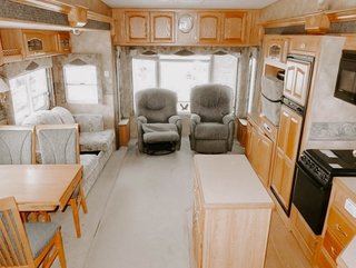 The wood paneling and dark colors made the living space feel small and cramped.