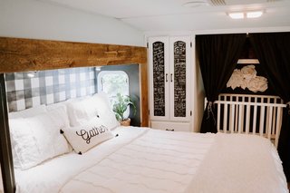 All of the walls and cabinets in the bedroom were repainted. The blinds and cabinet pulls were replaced, while the cabinet mirrors were painted over with chalkboard paint.