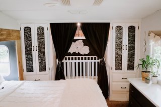 Even before the couple bought the RV, they knew they wanted a camper with a large closet that they could convert into a crib for their daughter, Piper. The sliding mirror doors were replaced with blackout curtains.