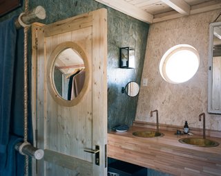 Saligna timber has been used for built-in counters in the double-sink vanity.
