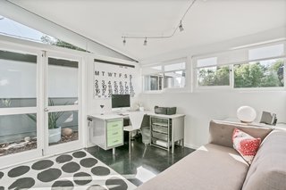 Here, a third bedroom has been converted into an office. The room faces the garage and opens up to the pool area.