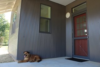 Buster’s Home is a two bedroom, one-bathroom house with a generous living area, an<br>inset front porch, and a small bonus room.