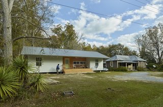 The fourteenth 20K House, Bobby’s Home, features a long, narrow front porch which serves a double function: it provides a social gathering space at the front of the home’s exterior, and it separates the private and social spaces on the home’s interior.