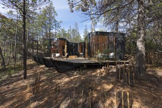 Some pavilions overlook the water, while others are nestled further into the coastal bushland.