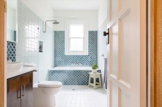 The main bathroom was remodeled and enlarged. Instead of chrome, Megan opted for hardware with a soft pewter finish.