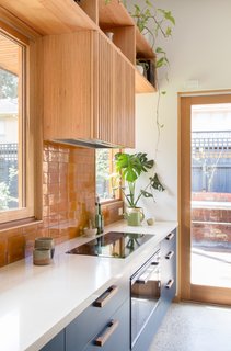 The compact 54-square-foot kitchen is equipped with an induction cooktop (no gas used). The countertops are Create Stone's White Quartz made with 72 percent post-industrial waste.