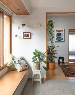 In the dining room next to the study is a deep window seat inserted on the north side of the home that overlooks the outdoor deck.
