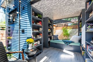 A built-in seat by the large window is the perfect place to curl up with a book. Mosa tiles from United Tile were used for the floors, and include built-in radiant heating.
