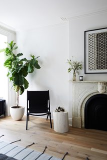 The master bedroom fireplace with a marble surround was also fully restored by the clients.