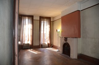 The fireplace in the living room had been blocked in with sheetrock by the former owners.