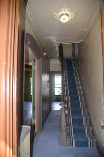 With worn walls, damaged ceilings, and dated carpet tiles, the former entrance was in desperate need of a refresh.