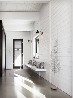 Here's a look at the entrance foyer that features a door leading out to the parking pad.