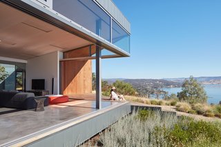 "The panoramic that wraps the house differs significantly on each side, such that the perception and experience of the place changes dramatically as one turns and moves around," add the architects.