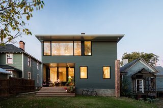 Durable fiber-cement HardiePlank clads the rear facade.