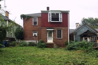 A look at the back of the former home with a poorly built upstairs addition that in situ studio demolished and rebuilt.
