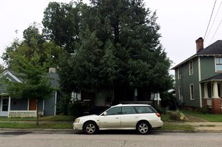 Before, the existing home was in shambles and blocked from view by a massive tree.