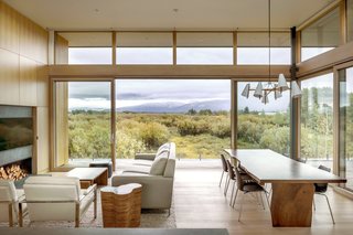 Floor-to-ceiling Lift/Slide doors by Weiland and clerestory glazing usher the outdoors in to the open-plan living and dining areas.