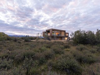 "Being a wetland, the site is covered in roughly 10' tall willow brush, and a small creek crosses the site lined with rugged Aspen trees," explain the architects.