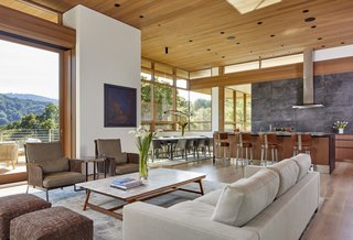 A soaring ceiling delivers a sense of drama to the open-plan great room.