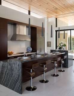 A three-inch Calcutta Prima slab was used on the kitchen range wall and backsplash.