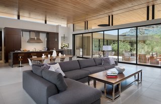 Verano-brushed 12x24 limestone flooring lines the great room. Ample glazing lets in plenty of natural light.