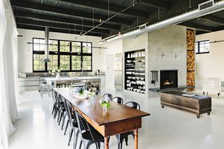 Matte-black Tolix chairs surround a 14-foot harvest dining table that dates back to the 1800s.