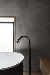 A close up detail of the bath faucet.