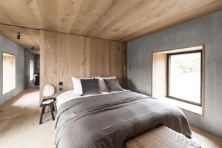 The bedroom is the most pared-back room in the house with just a handful of furnishings including a custom-designed bed.