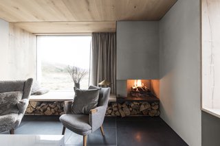 The fireplace is supplied with sustainably sourced timber from the estate.