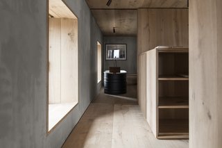 The free-standing bath is set next to a large window, framing views of Ben Loyal, an isolated mountain in Sutherland.