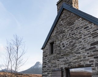 New openings have been cut into the gables and the rear elevation to frame picturesque views and bring more natural light indoors.