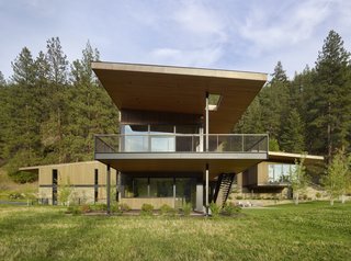 The spacious second-story terrace projects toward the south to overlook views of the meadow.