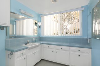 The home features one full bath and three partial baths.