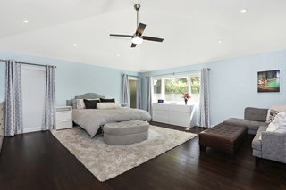 An addition built by the former owners was gut renovated and transformed into a new master suite with hardwood floors.