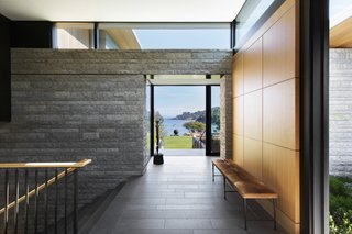 Aegean limestone continues from the exterior to the interior to create an effortless indoor/outdoor connection.