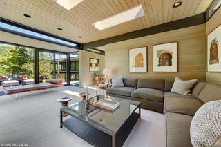 Cedar wraps around the home, from the ceilings to the walls, to impart warmth and to tie the building to the wooded landscape.