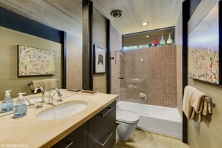 The guest bath, as with all of the bathrooms in the home, have been updated by the current owners.