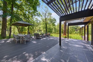 The slate floors continue seamlessly to an outdoor dining and living area outside of the kitchen.