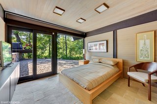 The fourth bedroom and third full bathroom are located on the lowest level and serve as the guest suite.
