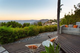 A pair of Acapulco chairs provide comfortable seating for soaking in valley views.