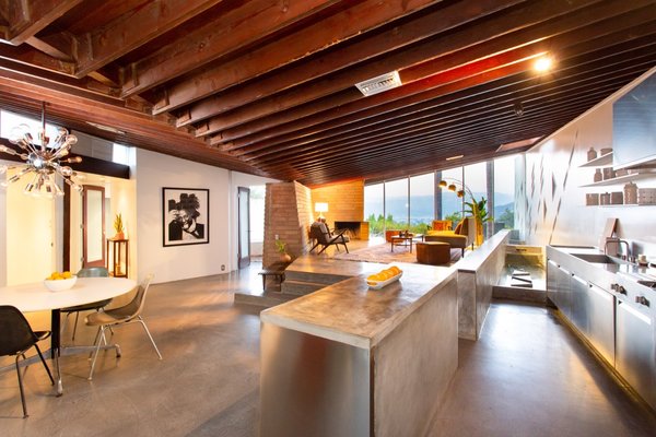The exposed redwood beams have been stripped of layered paint and carefully restored for a natural look.