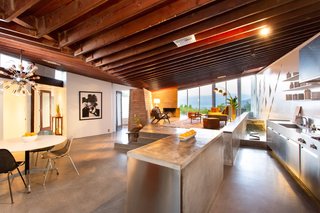 The exposed redwood beams have been stripped of layered paint and carefully restored for a natural look.