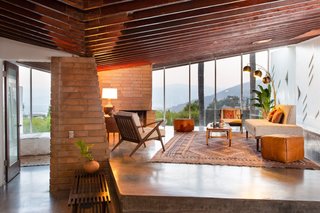 In contrast to the bright interior colors that originally dressed the home in the 1950s, the Bergren Residence now has a more restrained and subdued appearance that highlights the material palette.